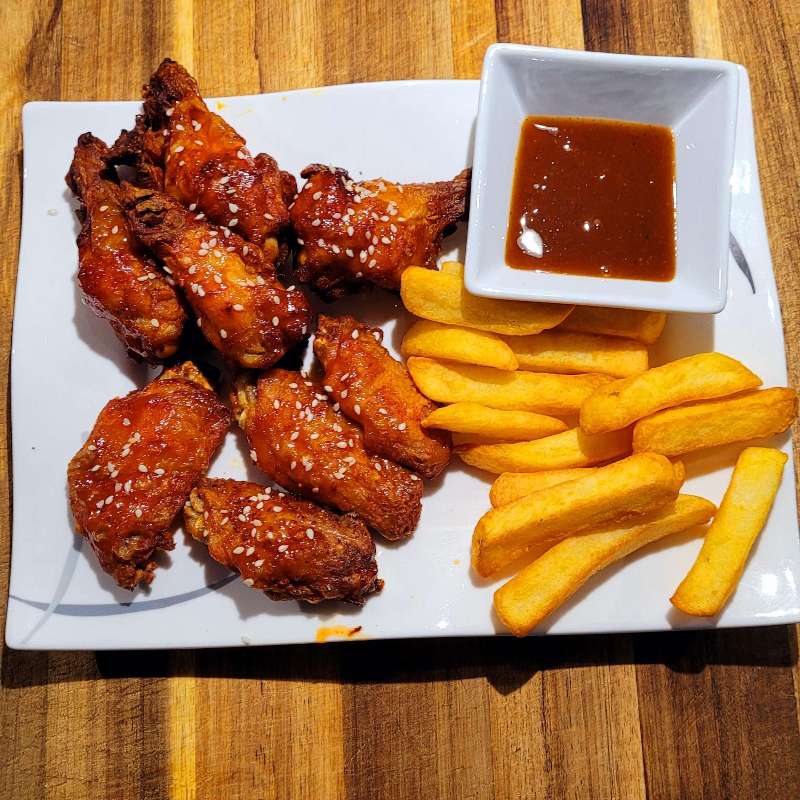 French fries with spicy wings